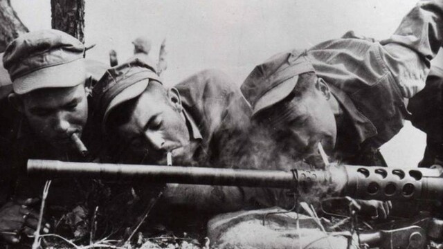 Soldiers Lighting Cigarettes From Overheated Gun Barrel