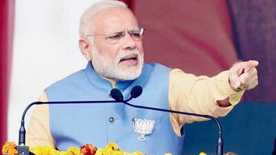 Narendra Modi addresses an election rally in Aligarh