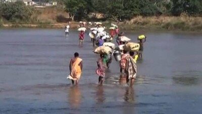 Anija-villagers-cross-river