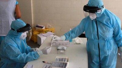 Health Workers In PPE Suit