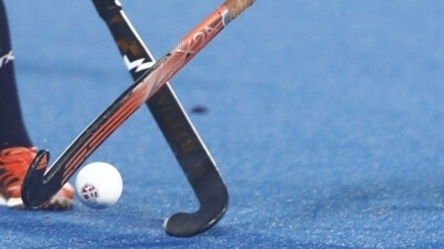 Row over 12 players of a team on pitch during Hockey World Cup match