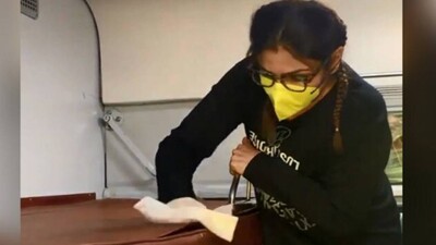 Raveena cleans train amid coronavirus outnreak