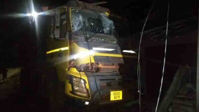 Truck rams house