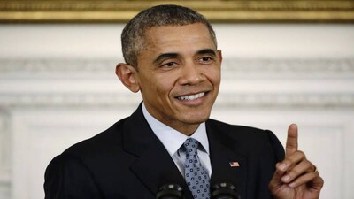 Image: U.S. President Barack Obama gestures while addressing news conference in the State Dining Room at the White House in Washington