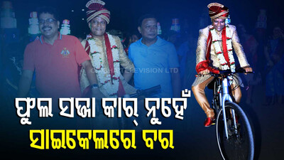 Groom Rides Cycle During His Marriage Procession 