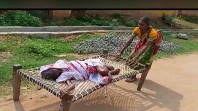 woman-dragged-on-cot