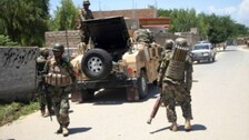 Taliban Militants Surround Major Afghan Cities