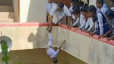 UP: Principal Hangs Kid Upside Down From Building